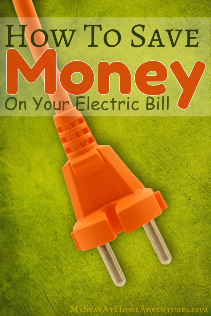 Orange electric plug on a green background illustrating tips on how to save money on your electric bill.