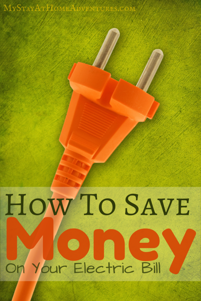 Orange electric plug on a green background, representing tips on how to save money on your electric bill.