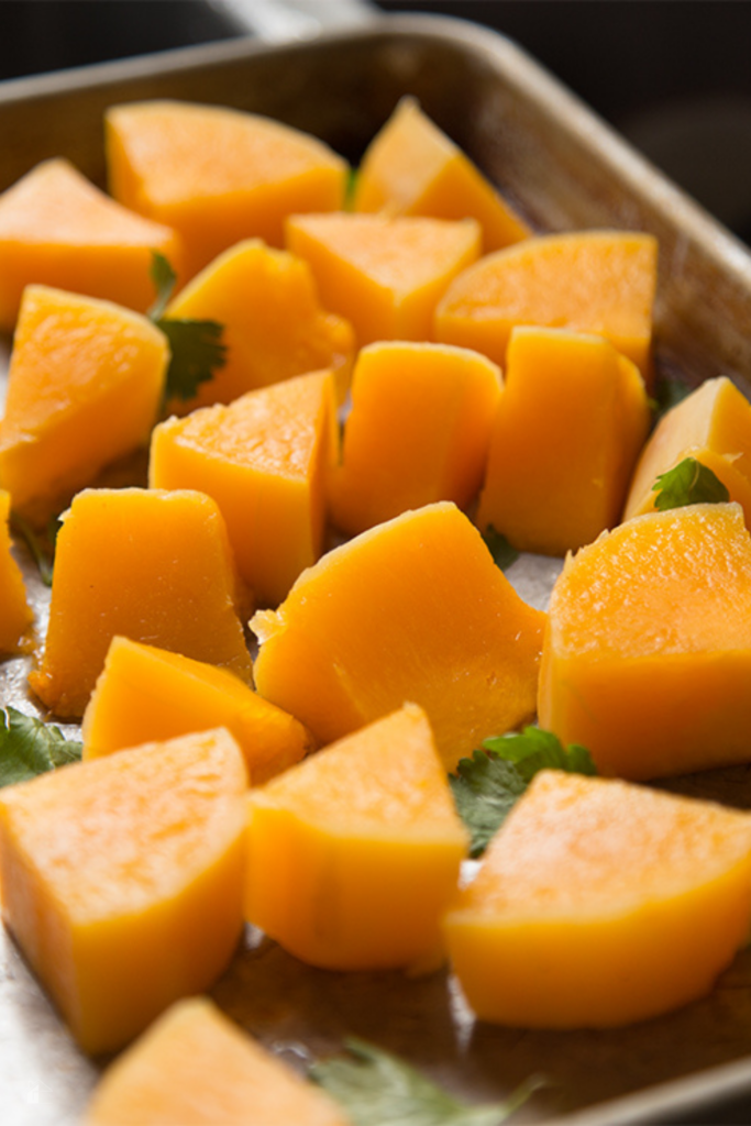 Chunks of cooked butternut squash on a baking sheet, ready to be served as a quick and easy side dish, prepared using an Instant Pot for a healthy fall recipe.