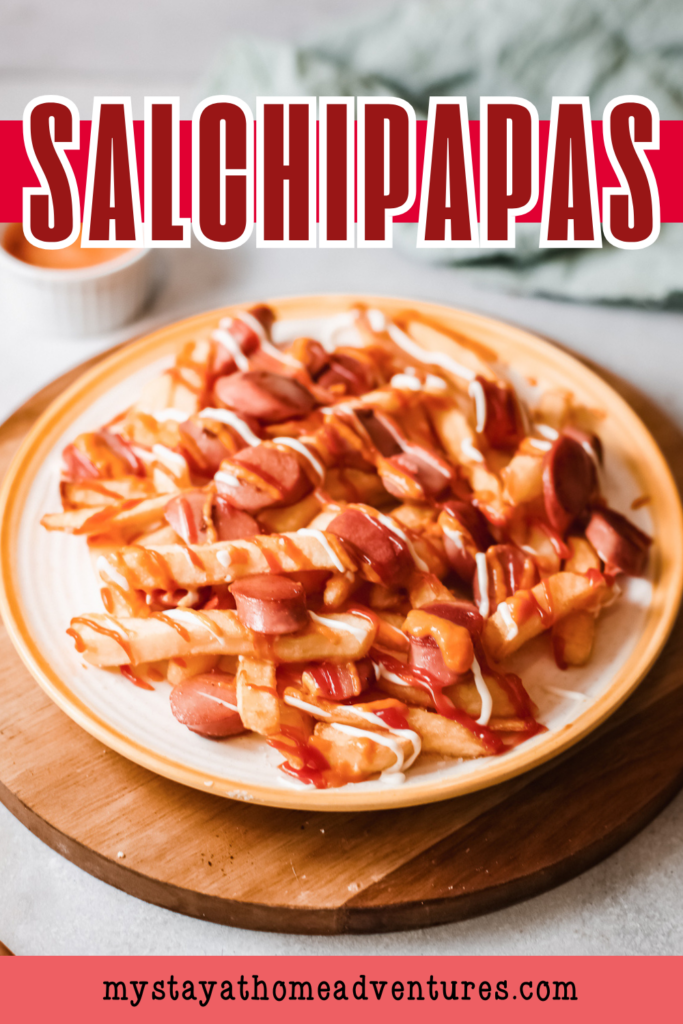 A plate of Salchipapas, a popular Peruvian dish made with crispy fries and sliced sausage, drizzled with ketchup and mayonnaise.