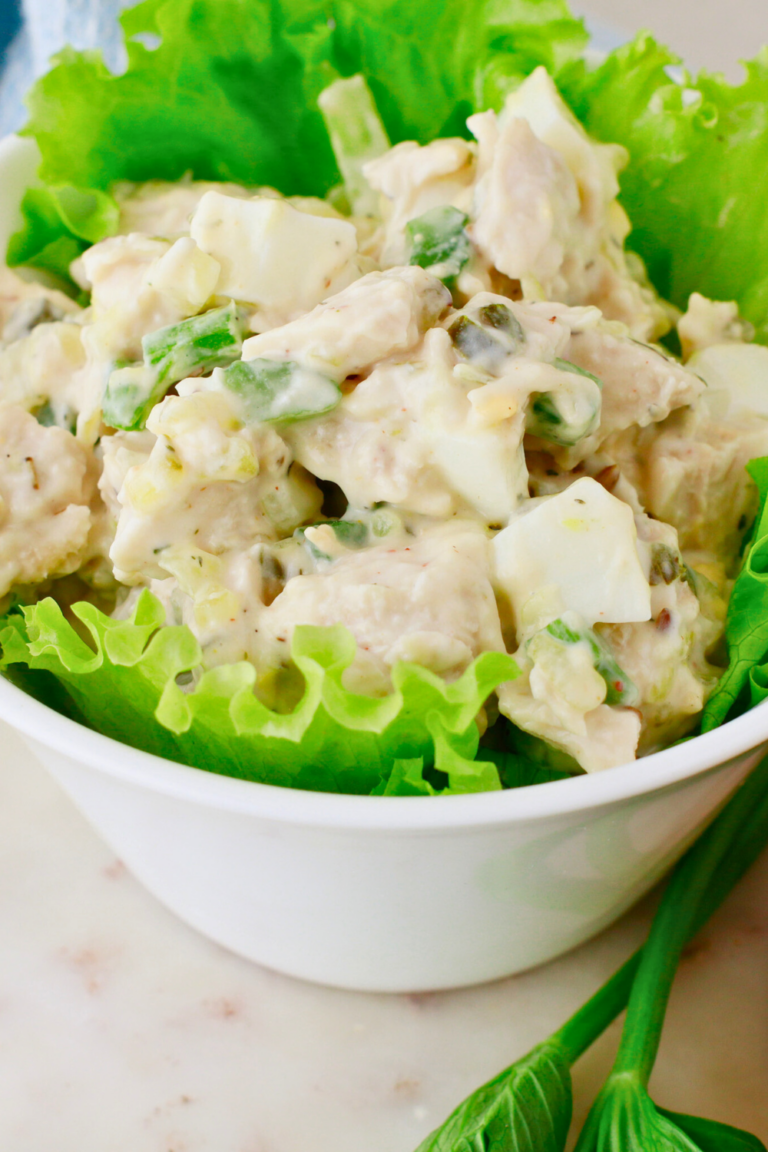 Classic chicken salad recipe made with tender chicken, hard-boiled eggs, celery, and a creamy mayo dressing, served on crisp lettuce—perfect for sandwiches, wraps, or a quick and easy meal.