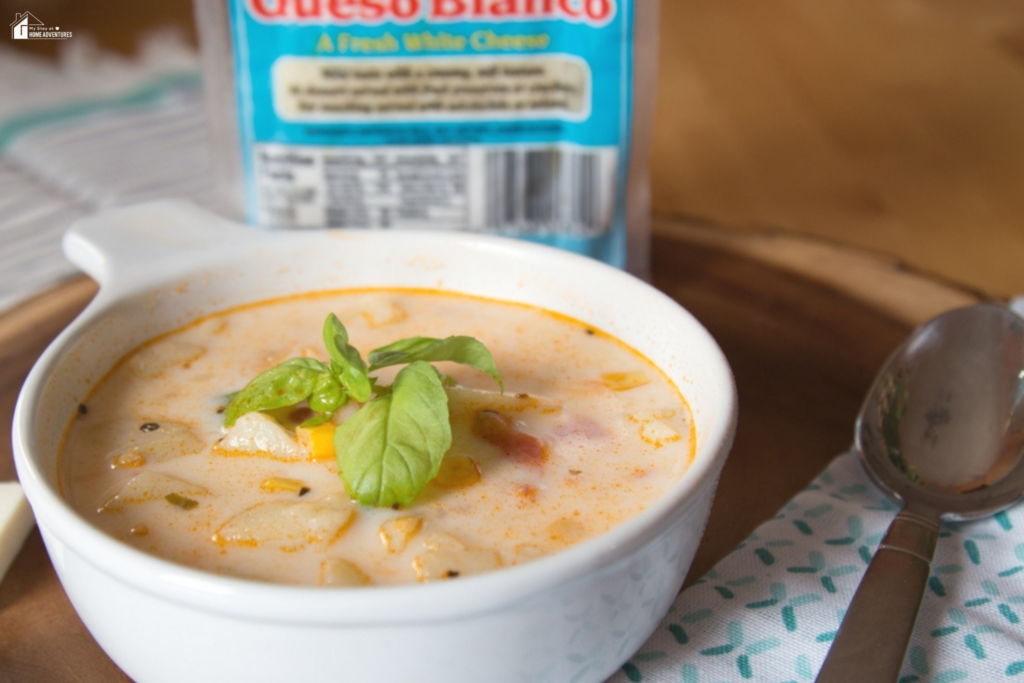 An image of Sopas de Papas y Tomate/Tomato and Potato Soup With Tropical Queso Blanco.