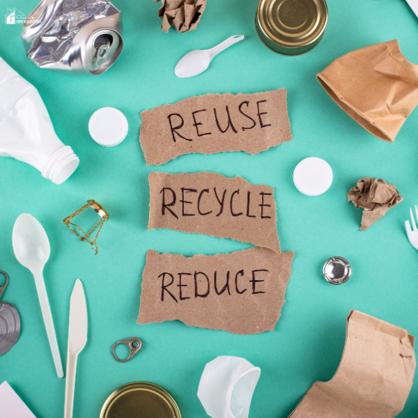 An image of Reuse, Reduce, Recycle with different things around it.
