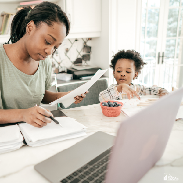 A mom with her child managing her finances.