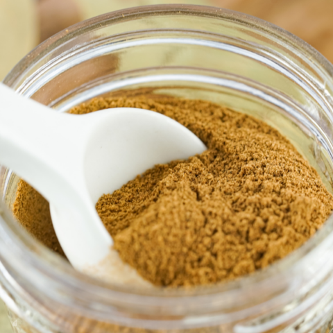 A close-up of a jar filled with homemade apple pie spice, ready to be used in fall dessert ideas and apple pie seasoning recipes. Learn how to make apple pie spice for your favorite homemade dry mixes.