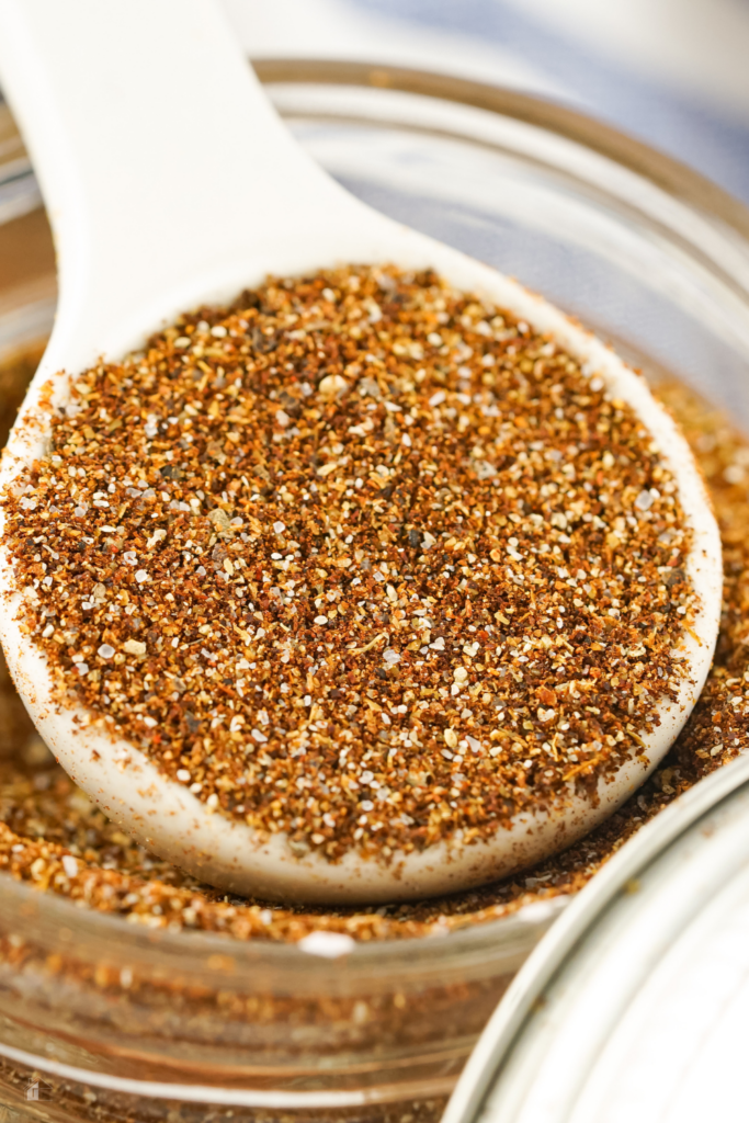 A close-up of a spoonful of easy chili seasoning mix, highlighting a well-blended combination of spices like chili powder, cumin, and cayenne pepper, perfect for enhancing the flavor of chili and other dishes.