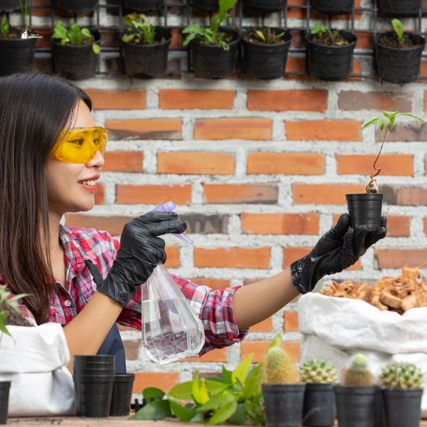 A woman wearing protective glasses and gloves while gardening, showing ways to protect your eye health while gardening from sun and debris.