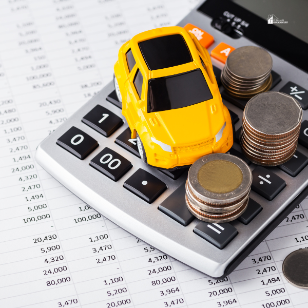 car and coins on a calculator