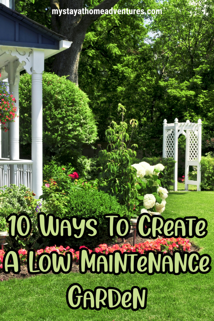 A lush garden featuring a white trellis, vibrant flowers, and manicured shrubs, showcasing ideas for creating a low maintenance garden with simple landscaping techniques.