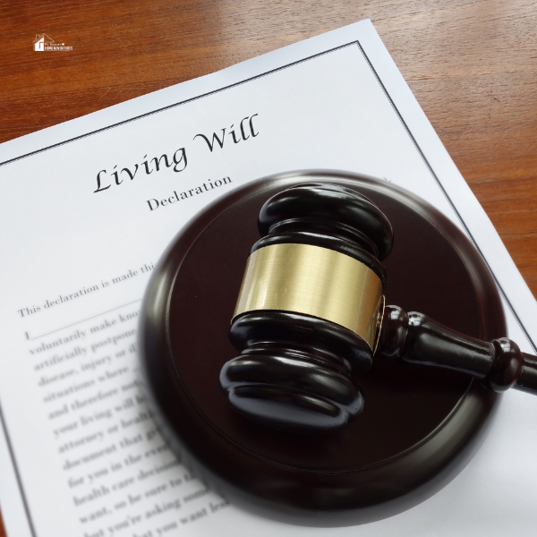 A legal document labeled "Living Will" with a judge's gavel on a wooden desk, representing a stay-at-home mom's guide to living will planning.