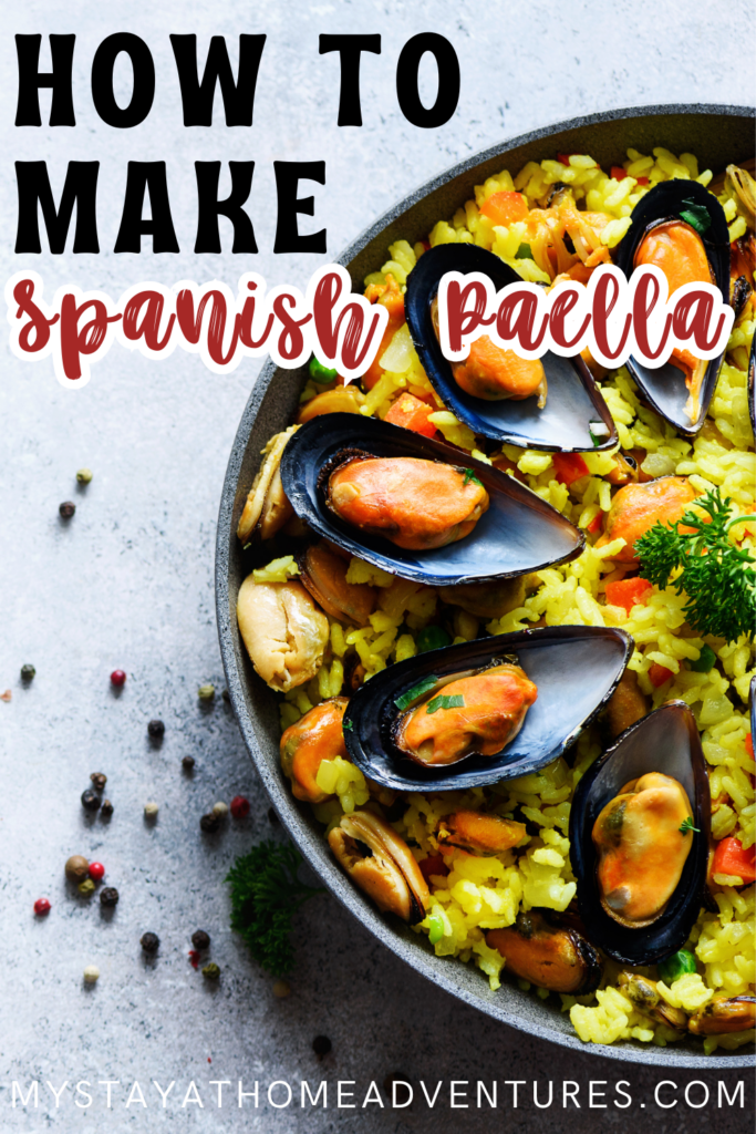 Top view of a bowl of vibrant Spanish paella garnished with mussels, rice, vegetables, and fresh parsley on a textured surface with scattered peppercorns.