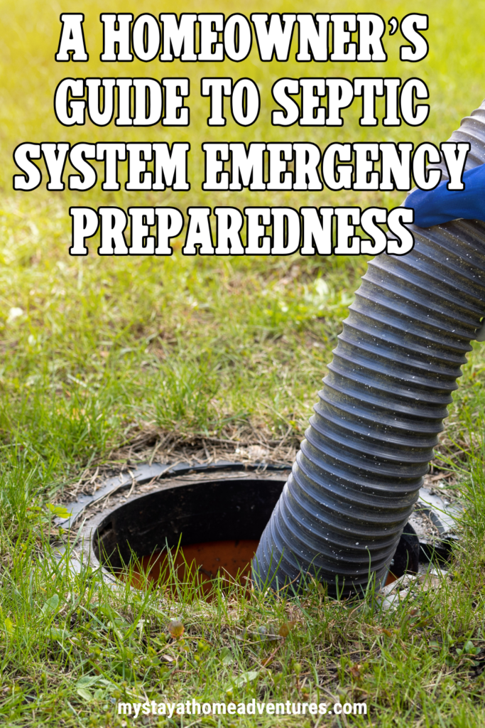 A hose inserted into an open septic tank for pumping and cleaning, demonstrating septic system servicing.