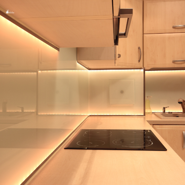 A sleek kitchen with under-cabinet LED lighting illuminating the countertop and backsplash for a modern and functional design.