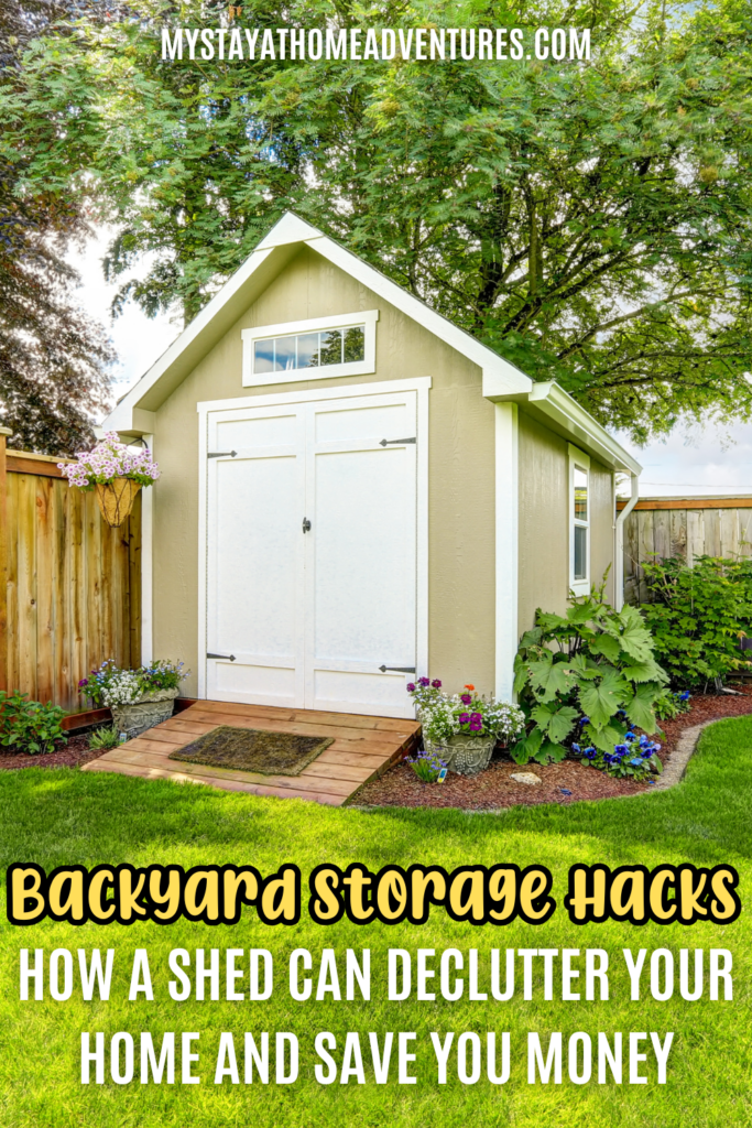 A neatly designed backyard shed with a small porch, surrounded by vibrant flowers and a lush green lawn, creating an organized and functional outdoor storage space.