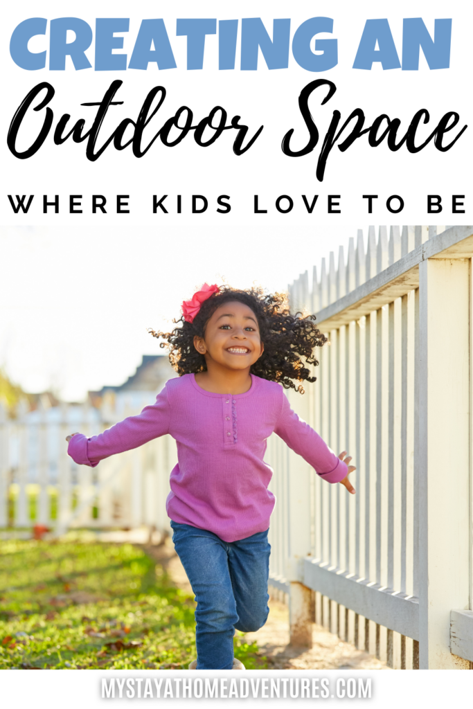 A joyful young girl in a pink sweater runs along a white picket fence in a bright and inviting outdoor space.