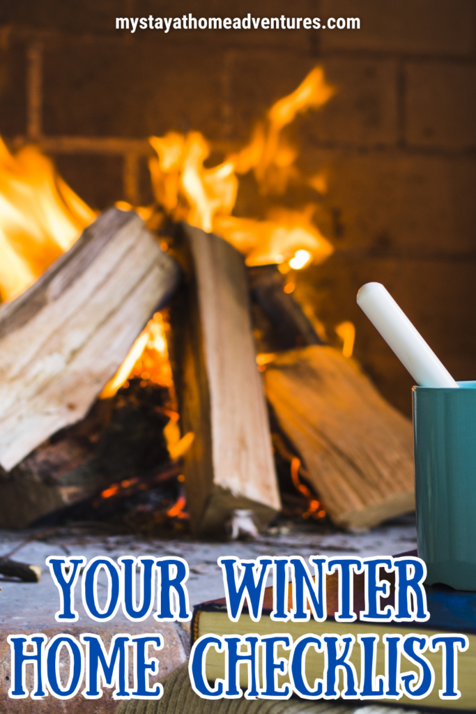 A cozy indoor fireplace with burning logs, a warm drink, and a book, creating a comforting winter atmosphere.